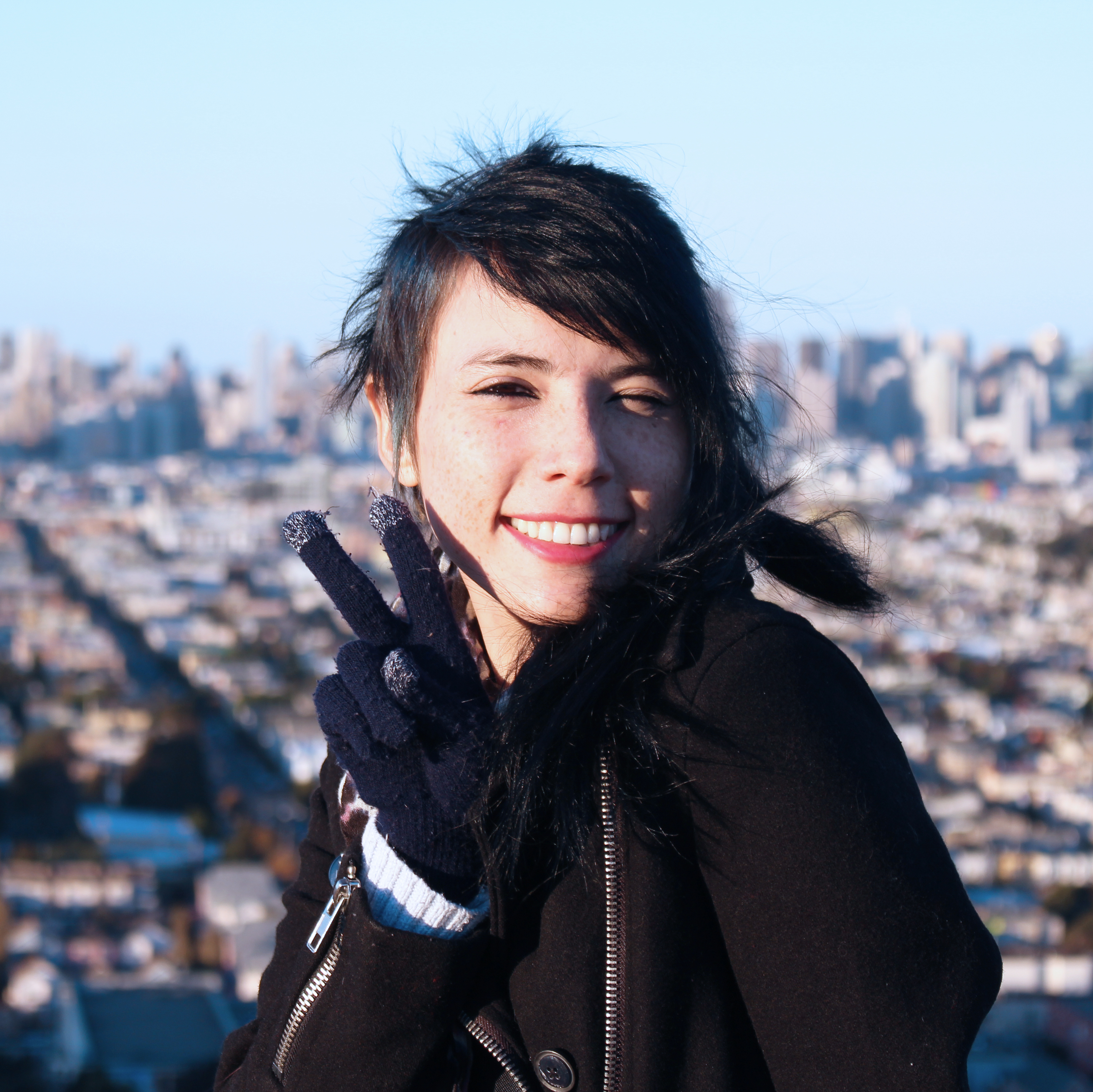 Image of myself at the top of bernal heights hill with San Francisco in the background